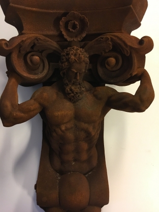 Very striking wall bracket -ornament with garing man, Polystone rest.